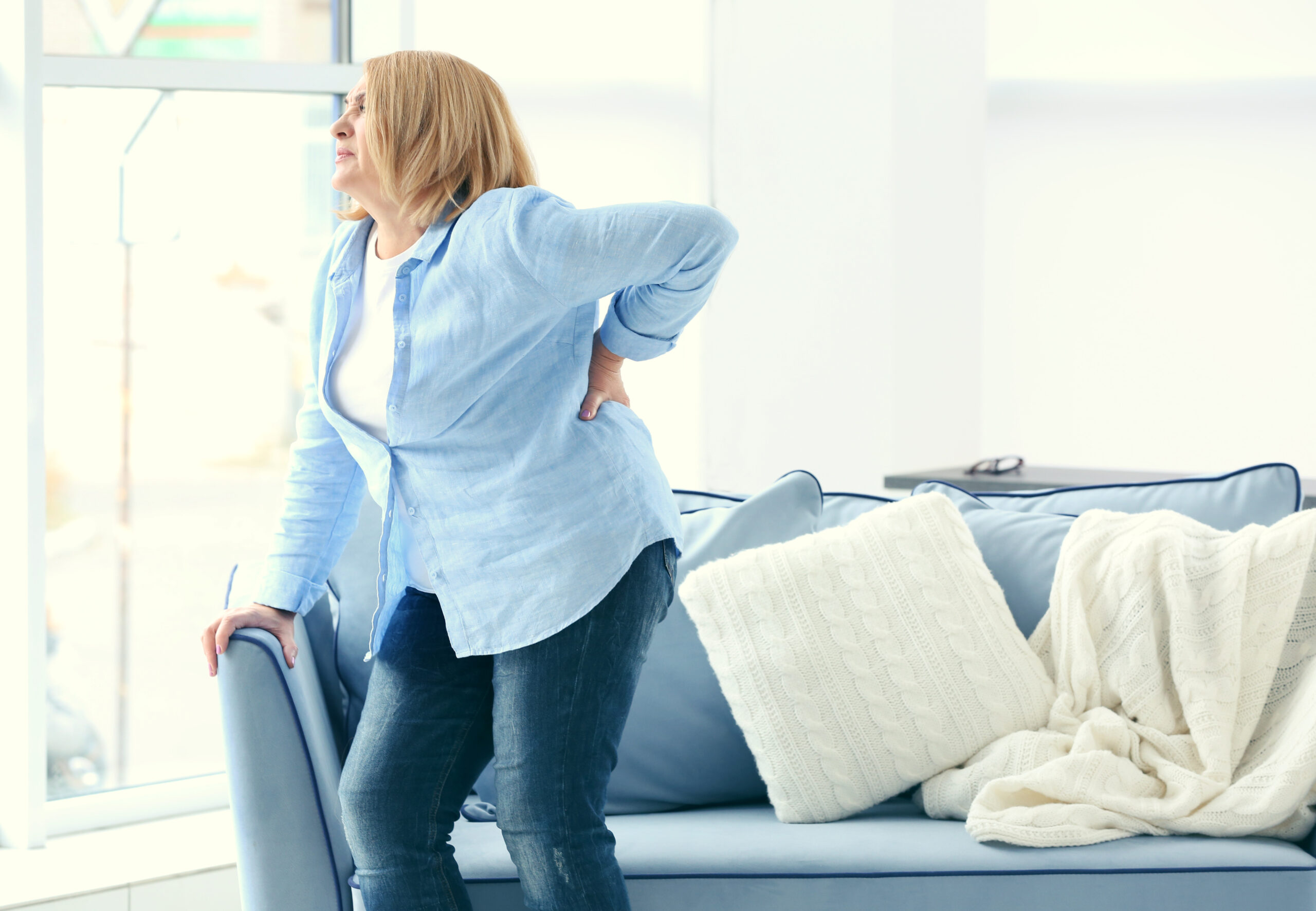 woman with chronic back pain - pain management without opioids